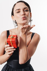 Sticker - Image of young happy woman smiling and holding small present box