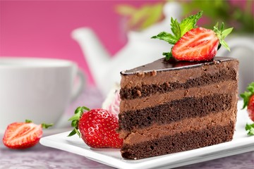 Sticker - Slice of delicious chocolate cake on the desk