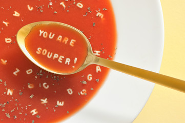 Soup With Letter Noodles On Spoon