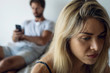 © PhotoAlto - Close-up of sad young woman sitting in bedroom