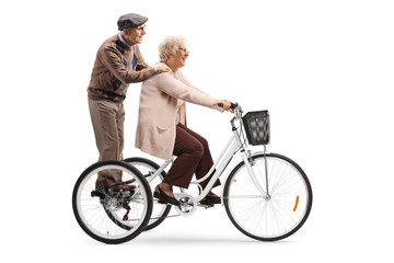 Poster - Elderly couple on a tricycle