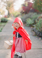 Little Girl Wears Little Red Riding Hood Costume For Dress Up