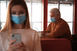 © New Africa - Senior man with medical mask in cafe. Virus protection