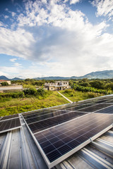 High angle of solar panels on roof of rural building in Guatemala.