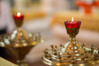 Ambiance of church, candles and bokeh yellow lights