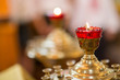 Ambiance of church, candles and bokeh yellow lights