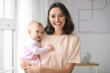 cute baby with mother at home