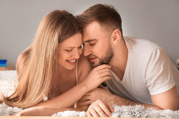 Wall Mural - Happy young couple in bedroom