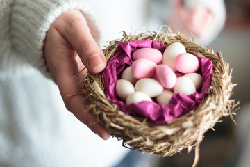 Canvas Print - Woman hands holding bird nest with Easter eggs