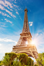 The Eiffel Tower In Paris On A Beautiful Sunny Summer Day At Sunset