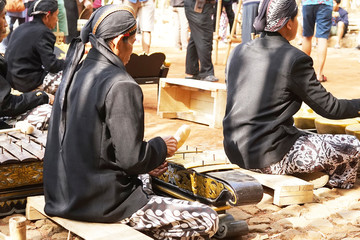 Playing traditional music instrument from Java Indonesia called 