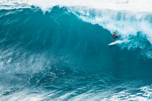 A Lone Surfer Enjoying A Big Wave In Hawaii.