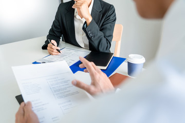 Wall Mural - Interview job concept, attractive candidate job seeker in suit answers employee for a business vacancy interviewing.