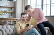 © zinkevych - Gay couple looking enjoyed talking with friends online