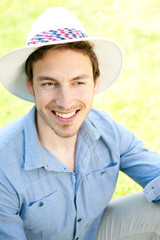 Happy young man on a meadow