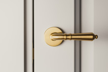 Brushed Gold Modern Design In Vintage Style Door Handle On A White Door.