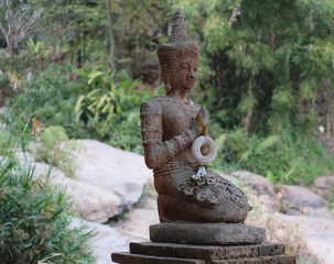 Buddha in the jungle forest. Chiang Mai, Thailand