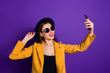 Wall Mural - turned photo of cheerful lovely cute girl travel video blogging make selfie on multimedia device cel