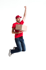 Wall Mural - Image of a young delivery man jumping and holding box