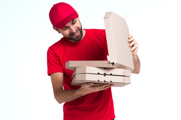 Wall Mural - Courier man picking into pizza boxes