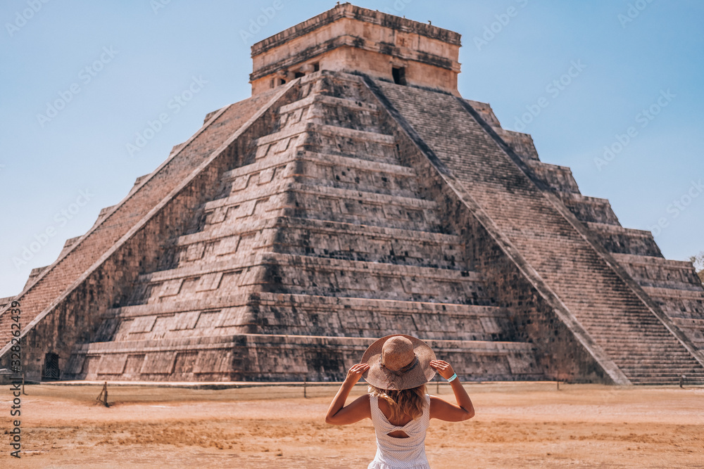 A woman enjoying travel tourism at Chichen Itza, Mayan Riviera, Mexico - obrazy, fototapety, plakaty 
