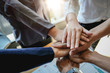 © Natee Meepian - Teamwork Success.  Business people group team happy showing teamwork and joining hands after meeting partner business in office. Business Concept