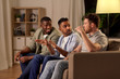 © Syda Productions - friendship, leisure and people concept - male friends talking at home