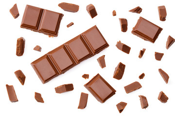 Milk chocolate pieces isolated on white background. top view