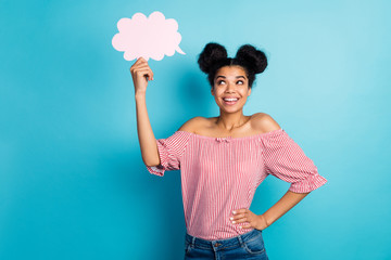 Poster - Photo of pretty dark skin lady hold empty paper cloud look up dreamy think over creative speech wear striped red white off-shoulders blouse jeans isolated blue color background