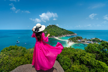 Wall Mural - Beautiful girl standing on viewpoint at Koh Nangyuan island near Koh Tao island, Surat Thani in Thailand.