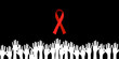World Remembrance Day of AIDS Victims concept. Symbolic red ribbon and pale hands of people who died of this illness