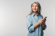 Image Of Adult Mature Woman With Long White Hair Holding Cellphone