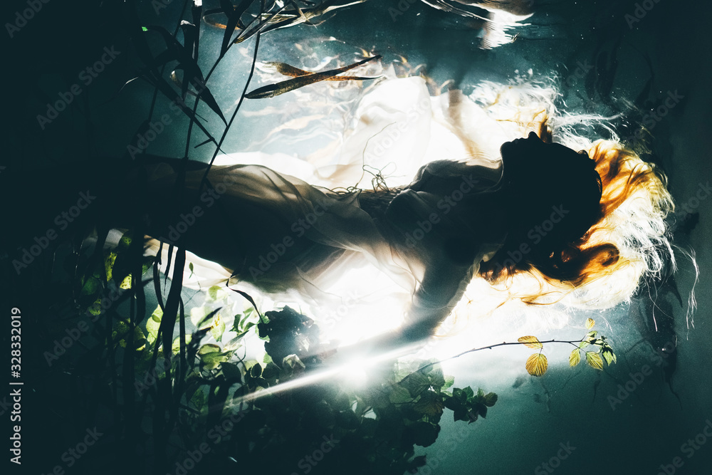 Silhouette underwater girl with long hair. Swimming Mermaid. - obrazy, fototapety, plakaty 