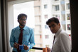 © abir - Corporate meetings with coffee/tea between young and energetic Indian Bengali bosses/officers/managers and secretary at balcony of the office building regarding a project. Indian corporate lifestyle