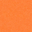 The texture of orange velvet paper. Bright seamless background