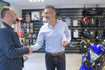 vendor congratulating a client for a new bike