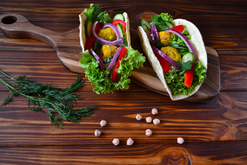 Mexican tacos with vegetables and falafel.