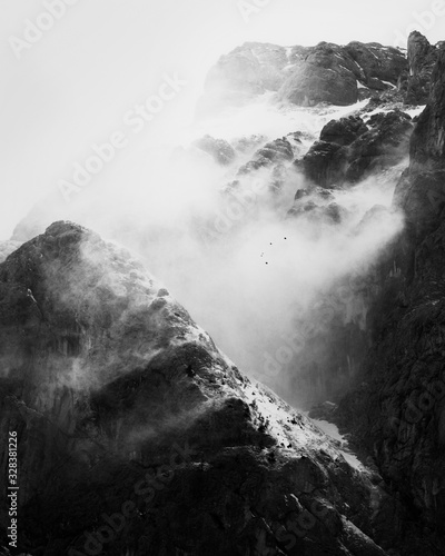 Dramatic clouds over alpine mountains in winter