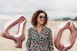 Attractive curly brunette celebrating her 40th birthday with big balloons
