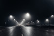 © Mulderphoto - Foggy misty night road and overhead pedestrian bridge illuminated by street lights