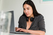 © Jamie Grill Photography/Tetra Images - Woman using laptop