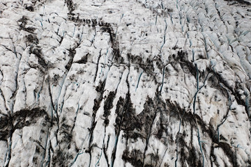 Above drone view of dirty icelandic glacier surface