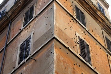 On Via Rasella in Rome, Italy, bullet holes remain in the walls of a building from the March 23,1944 attack by the Italian Resistance against German military police that killed 32 men.