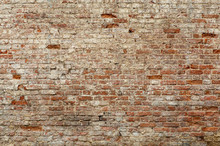Old Brick Wall. Brickwork From An Old Brick In A Rustic Style. The Structure And Pattern Of The Destroyed Stone Wall. Copy Space