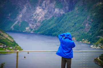 Canvas Print - Tourist at fjord Geirangerfjord, Norway.