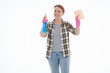 © Nastya_Gepp - Portrait of happy female doing house duties wearing rubber gloves and holding cleaning equipment. Cheerful look. Hygiene, cleaning service concept. Isolated picture. White background.