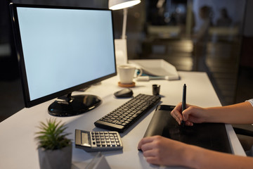 business, design and technology concept - hands of woman or graphic designer with computer and pen tablet working at night office
