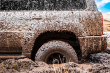 Adventure Travel Concept Background. 4x4 Off-road Suv Car Stuck In Mud. Adventure Travel Concept Background. Offroad Car.