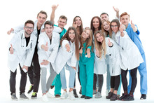 Top View. A Group Of Smiling Doctors Pointing At You.