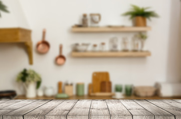 Wood table top on blur kitchen room background .For montage product display or design key visual layout.